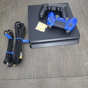 Sony PlayStation 4 Console with Black and Blue Controllers
